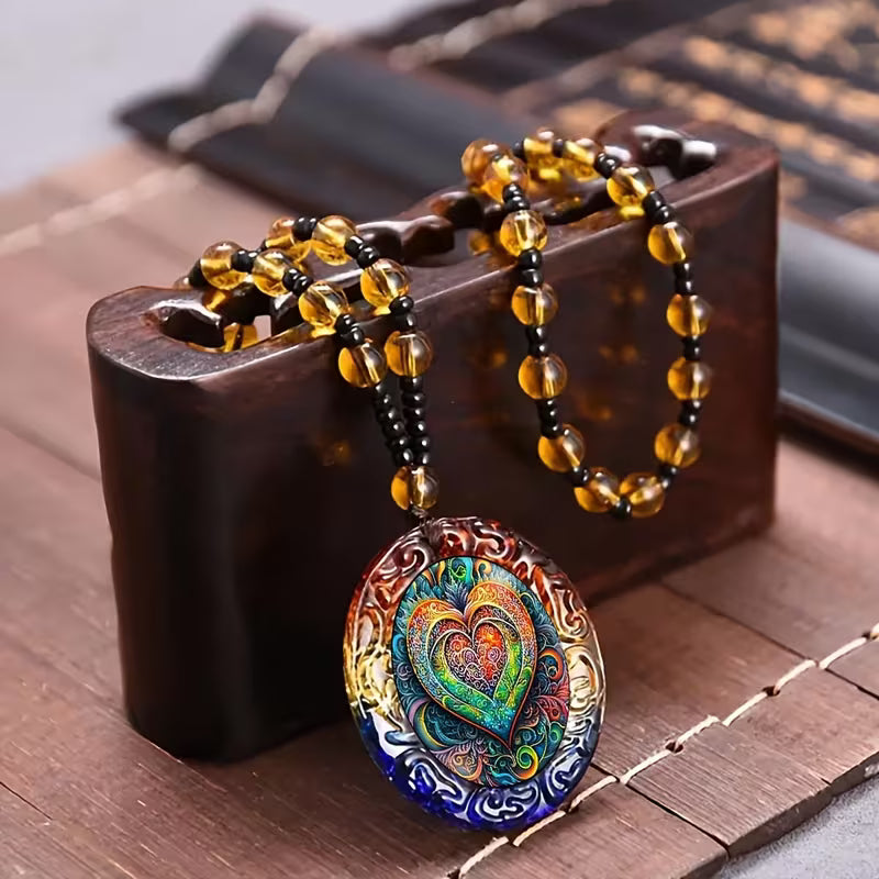 Vibrant And Fashionable Pendant in The Shape of a Swirling Rainbow Heart, Paired with a Chic Oval Necklace